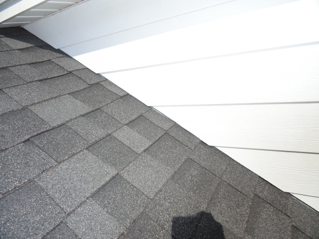Siding and shingles should not come in contact with each other.