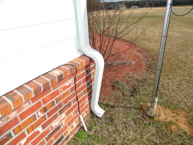 Downspout not extending far enough away from foundation.  Madison, Mississippi
