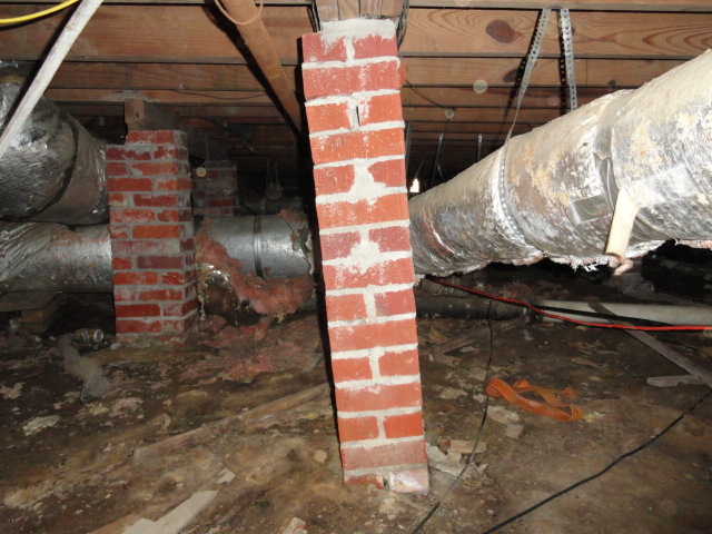 Severely leaning column in crawlspace.  62 year old Jackson home.