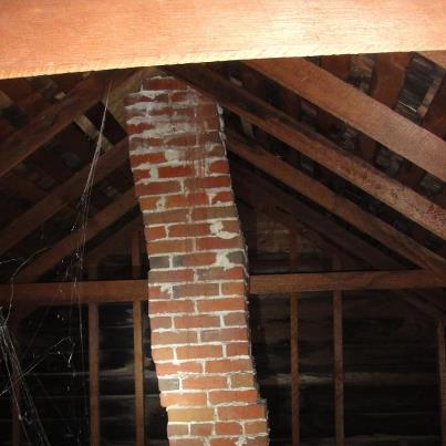 Chimney in attic leaning and dangerous!