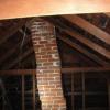 Chimney in attic leaning and dangerous!